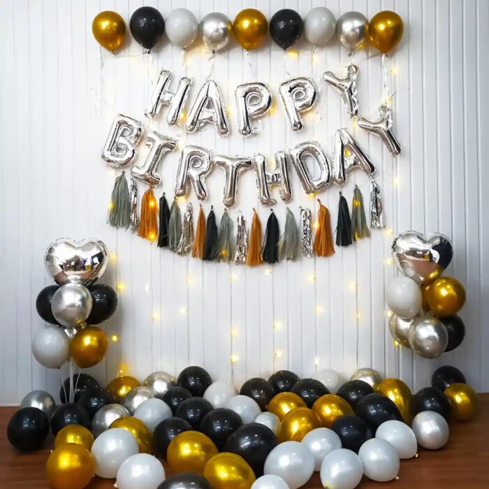Elegant grey and gold birthday balloon arch for a sophisticated celebration.