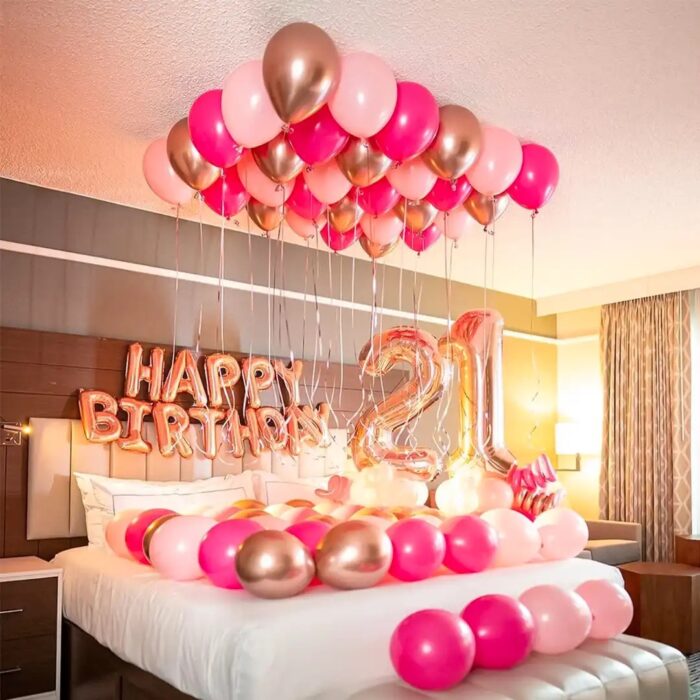 Elegant birthday room decor featuring shades of pink balloons